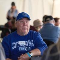 Andy Beachnau sitting at table with people